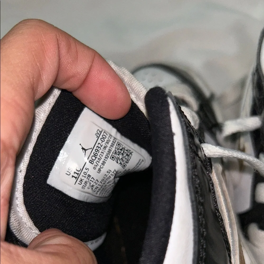 Nike Kids Black and White Sneakers with Gold Accents